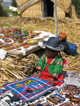 Uros child and handicrafts