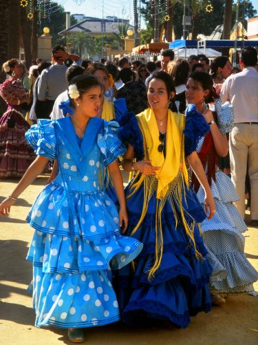 Women in traditional flamenco-style dresses