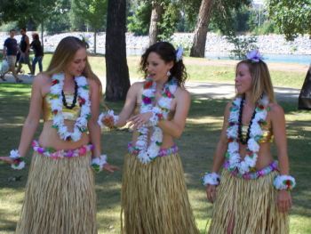 Three women wearing lei